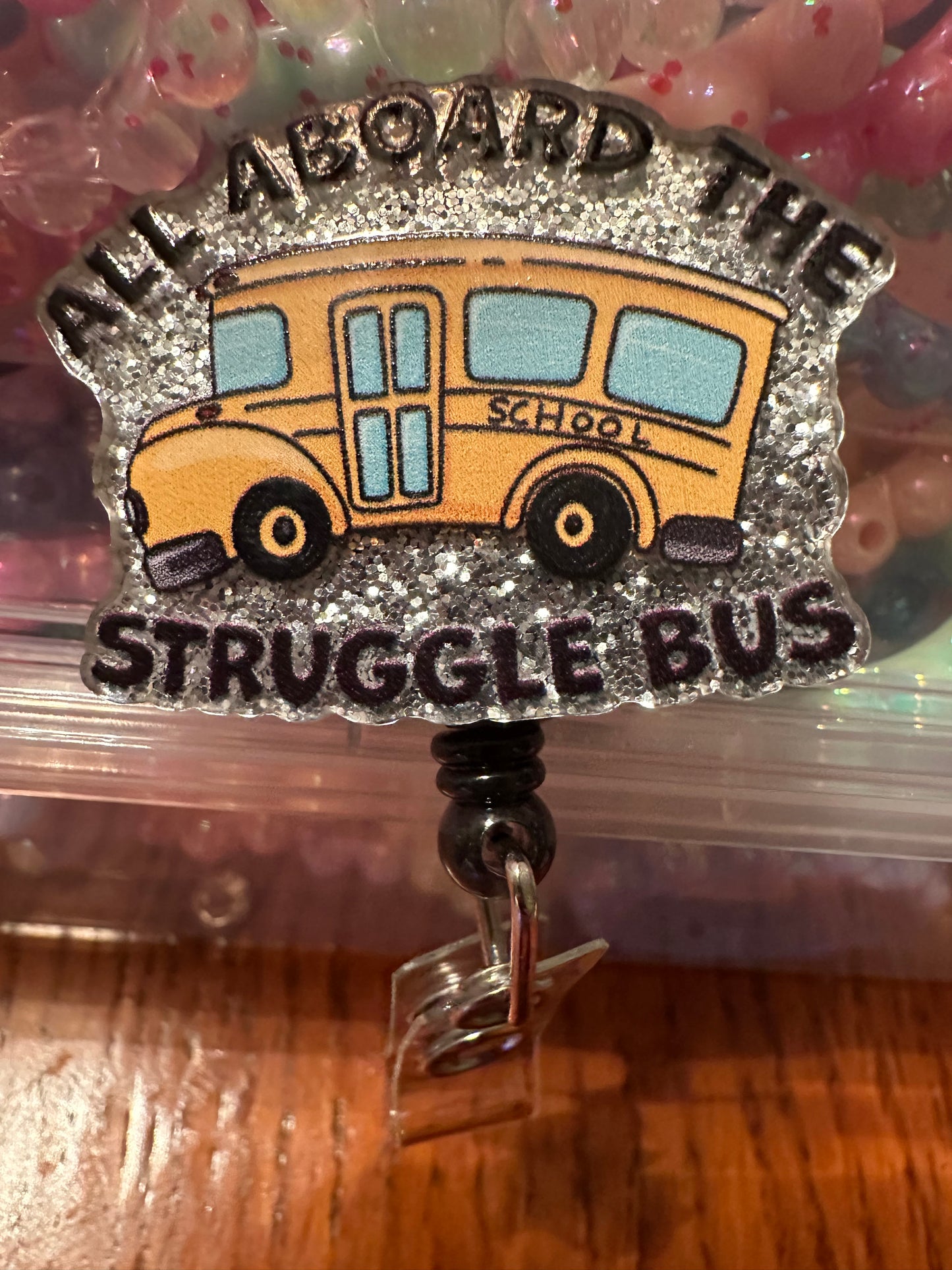 Struggle bus badge reel