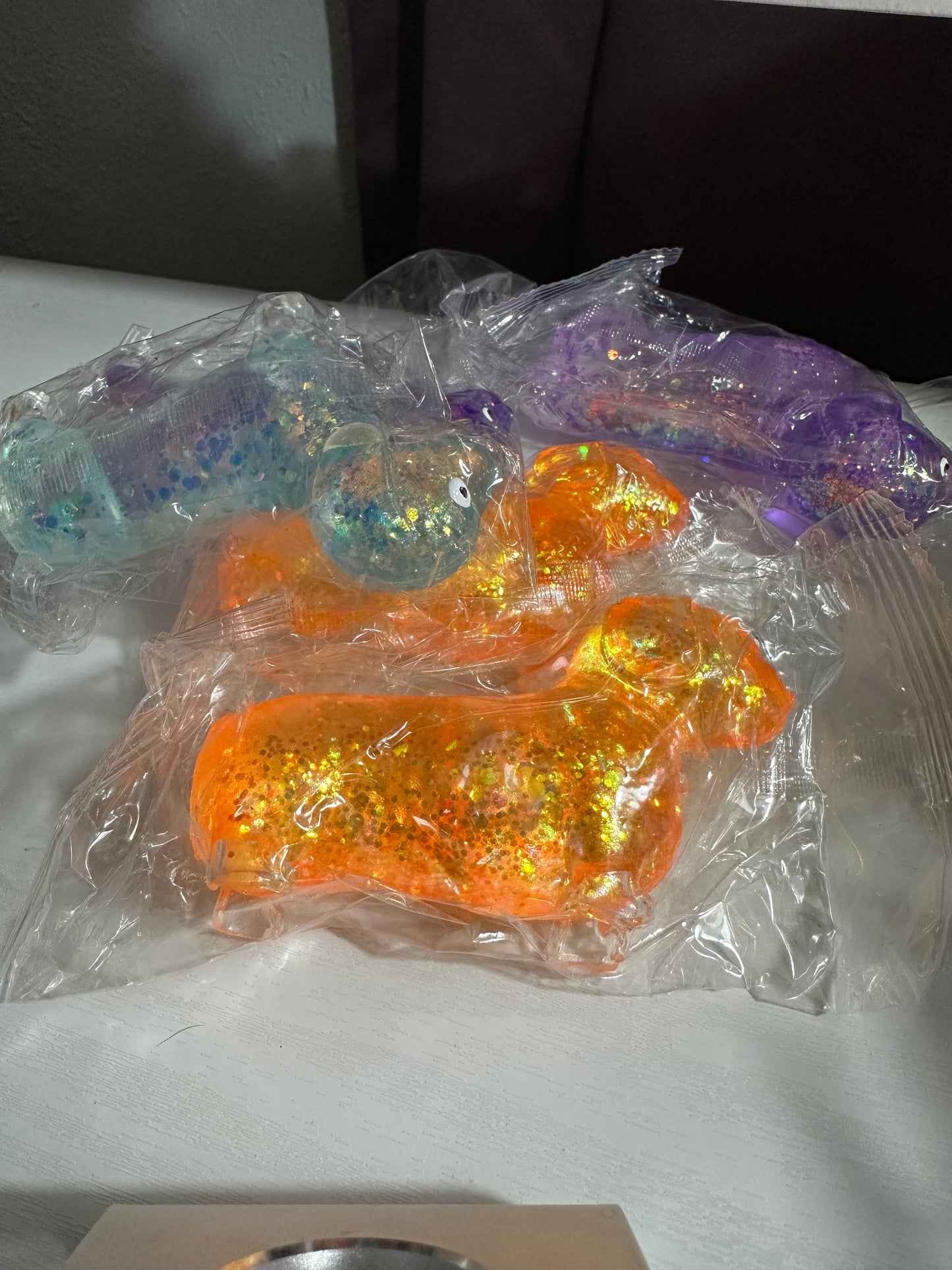 Dachshund squishy toy (2 orange, 2 purple, 1 blue)