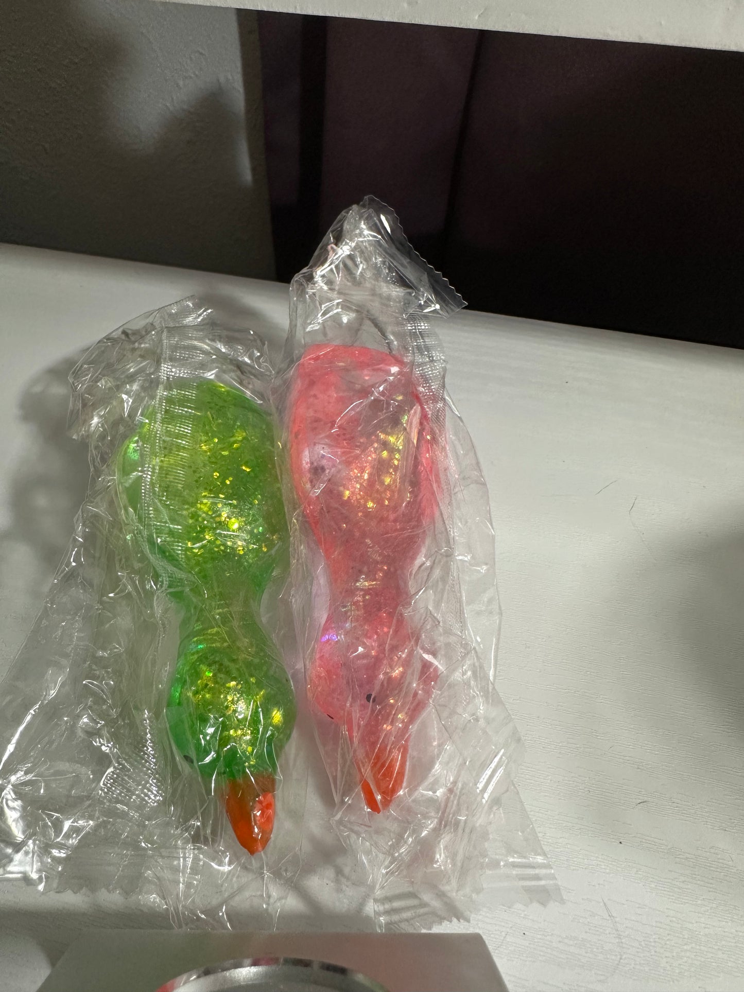 Laying down duck (1 pink and 1 green)