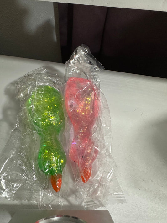 Laying down duck (1 pink and 1 green)