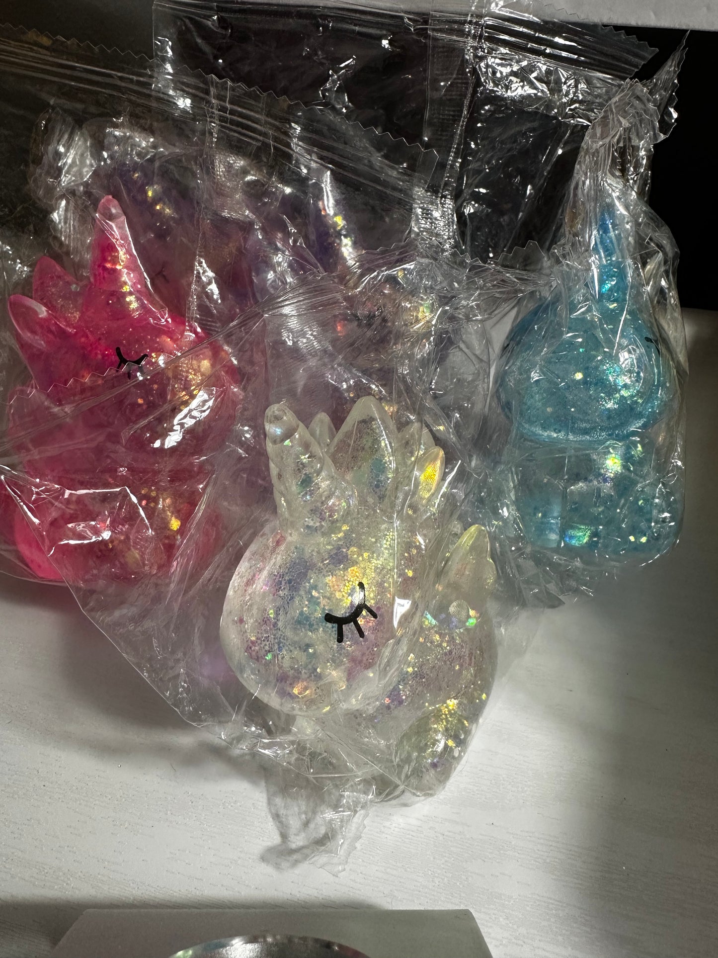Slow rise unicorn squishy toy (1 blue, 2 purple, 2 pink, 1 clear available)