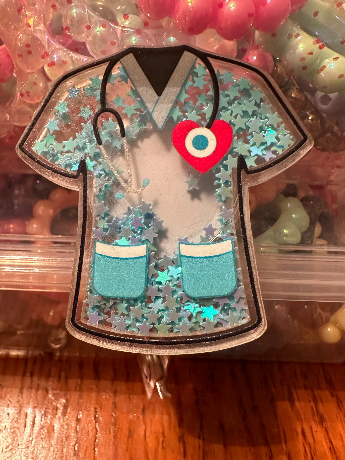 Scrub top badge reel